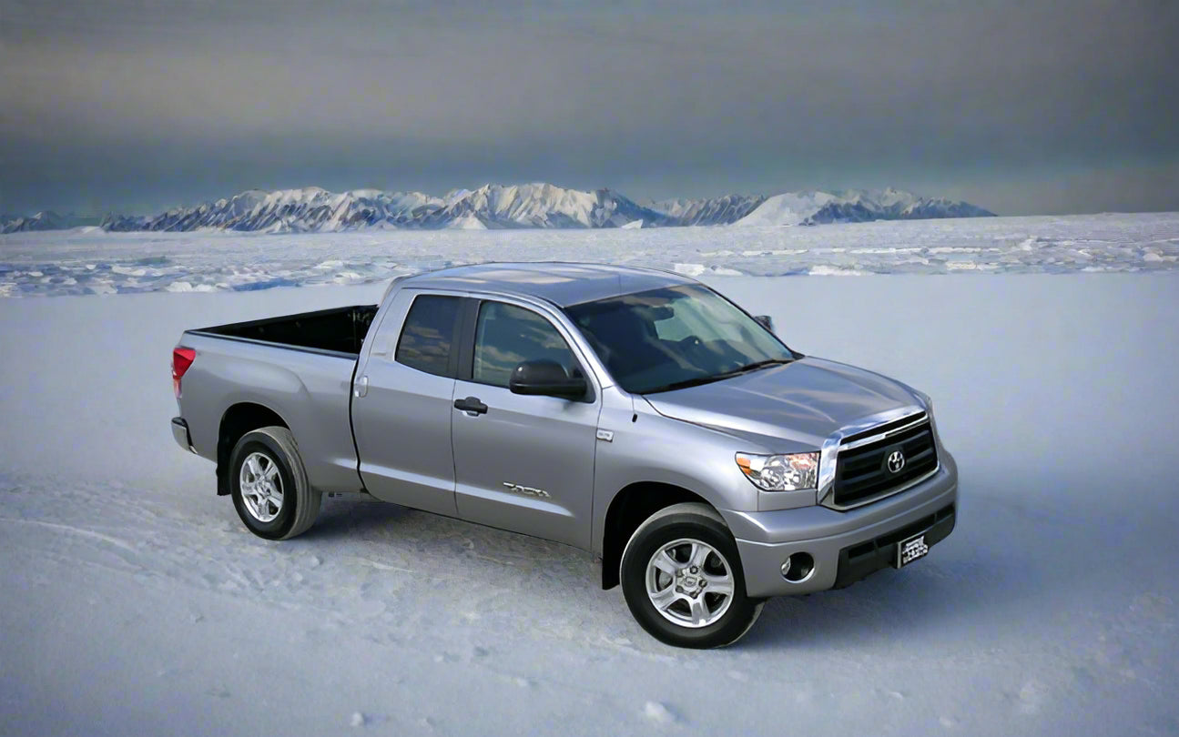 Silver Toyota truck parked in an arctic environement
