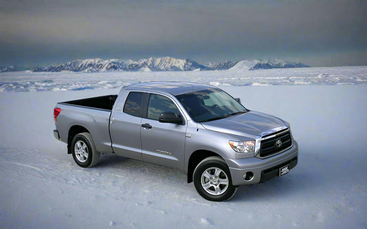 Silver Toyota truck parked in an arctic environement
